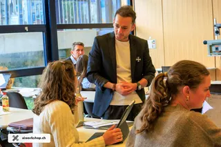 Innovation Time Lausanne AI workshop, facilitator engaging students in a university classroom